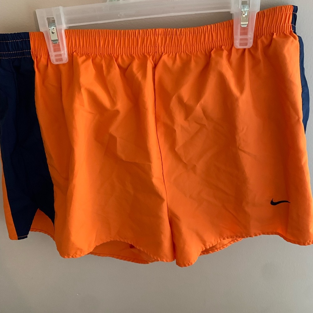 NIKE ORANGE AND BLUE SHORTS, SIZE MEDIUM.